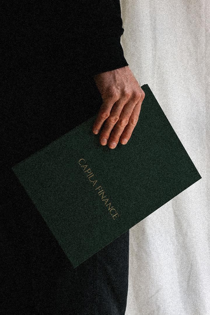 Capila Finance folio held in hand